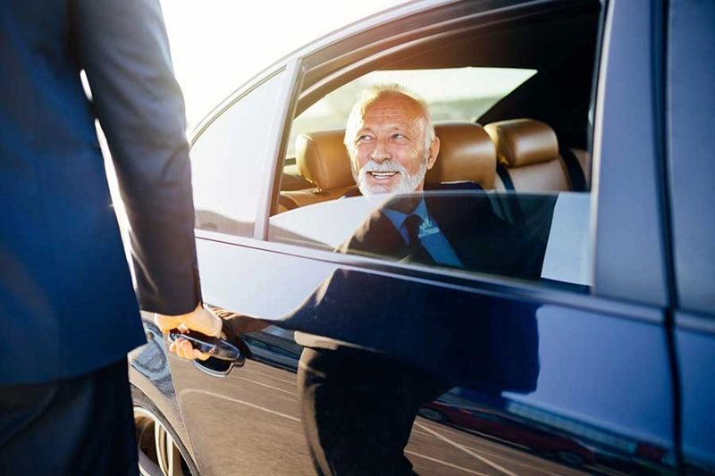 Corporate travel Chicago with a luxury executive vehicle and professional chauffeur for business transportation.